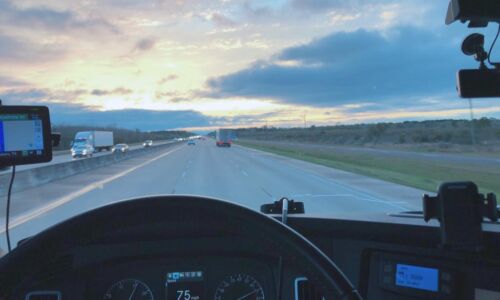 White ABGL truck on highway